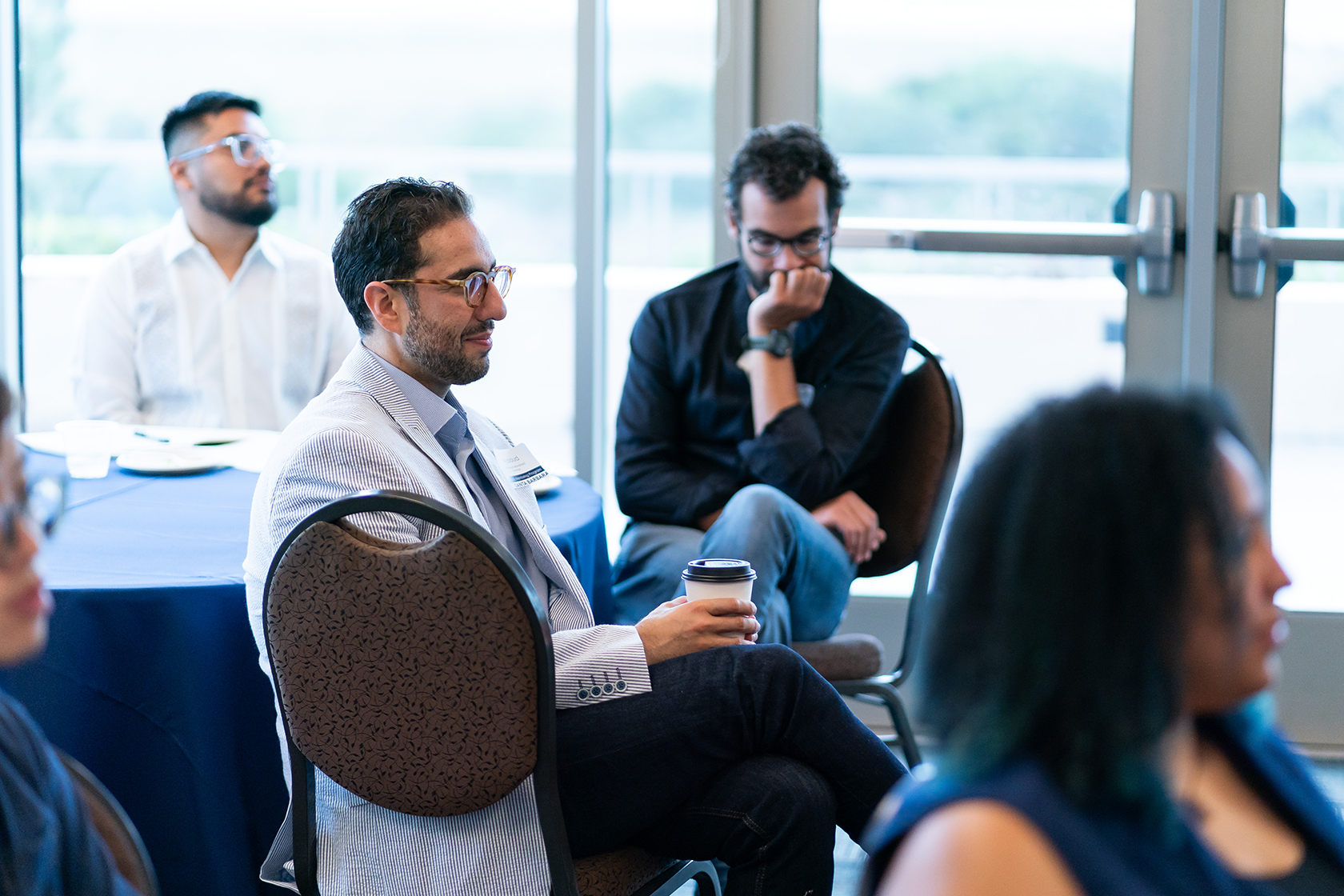 seated people listening to presentation