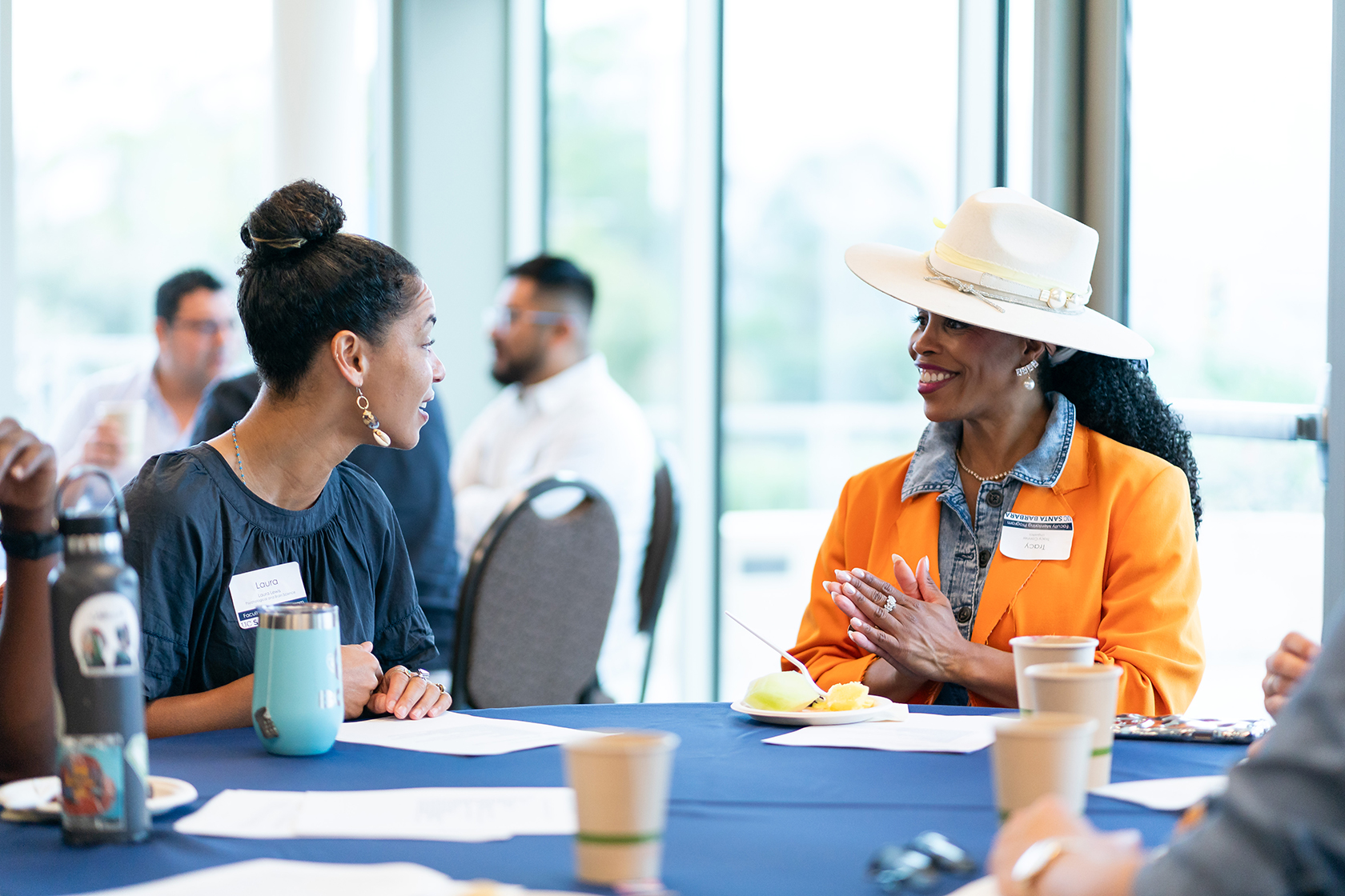 two people seated talking